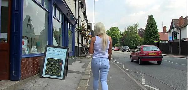  Blonde, shows her big tits while she enjoys pissing around the city